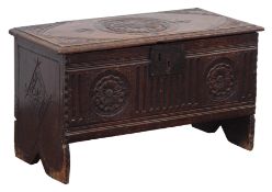 Small 17th century oak planked coffer, hinged moulded top with carved spandrels and centre motifs,
