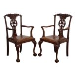 Pair of Chippendale style mahogany elbow chairs,