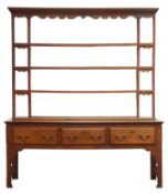18th century and later dresser, four tier open back with projecting cornice and shaped frieze,