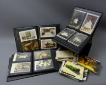 Large quantity of Edwardian and later postcards, loose and in a modern slipcase of three albums,
