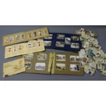 Quantity of cigarette cards, loose and in three albums, by Players, Wills,