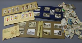 Quantity of cigarette cards, loose and in three albums, by Players, Wills,