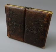 Victorian photo album, double folding embossed leather cover with brass clasps,