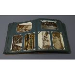 Postcard album containing over three hundred Edwardian and later postcards including real