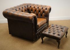 Chesterfield armchair upholstered in deep buttoned brown leather (W105cm) and a matching footstool
