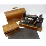Singer sewing machine in oak case with footmat, Victorian work box containing cotton reels,