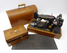 Singer sewing machine in oak case with footmat, Victorian work box containing cotton reels,