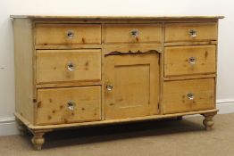 Victorian stripped pine dresser base, seven drawers, single cupboard, turned supports, W138cm,