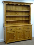 Polished pine dresser, projecting cornice, three shelf back above three drawers and cupboards,