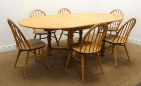 Ercol light elm oval extending dining table, turned supports, 'X' framed stretchers W213cm, H73cm,