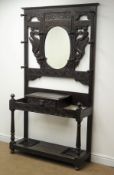 Victorian carved hall stand, raised oval mirror back, single drawer,