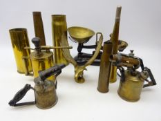 Four brass shell cases, British Monitor blowlamp and two others, brass model of an eagle,