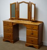 Pine twin pedestal dressing table, raised shaped back, six graduating drawers,