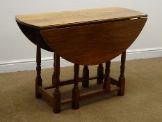 Early 20th century medium oak drop leaf table, gate leg action, turned supports, W110cm, H73cm,