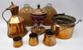 Set of three graduated copper cider measures,