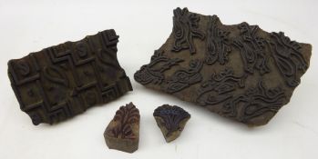 Four 19th century wooden printing blocks, one with carved bird motif,