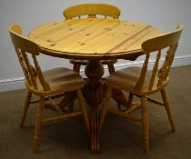 Circular pine table, single turned column on three splayed supports (D105cm,