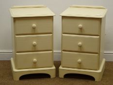 Pair cream finish bedside chests, three drawers, shaped plinth base, W43cm, H68cm,