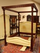 Regency style mahogany four poster bed with reeded floral carved supports,