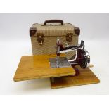 Vintage children's sewing machine in original case