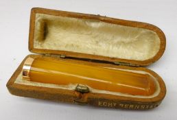 Edwardian amber cheroot holder with gold band,