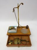 Early 20th century brass balance scales on mahogany base, incomplete,