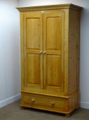 Solid pine double wardrobe, projecting cornice, two doors enclosing hanging rail,
