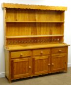 Pine kitchen dresser, with twin shelf back above three drawers and three cupboards,