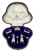 Silver five piece condiment set with matching spoons by E S Barnsley & Co,