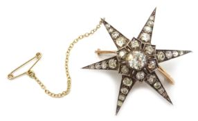 Victorian gold diamond star brooch/pendant, central diamond approx 0.