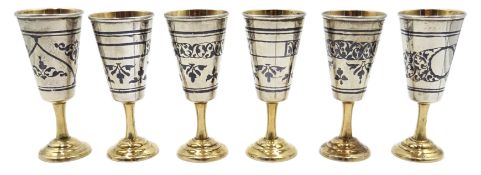 Set of six Russian niello silver and parcel gilt vodka cups, stamped 5KXK, approx 7.