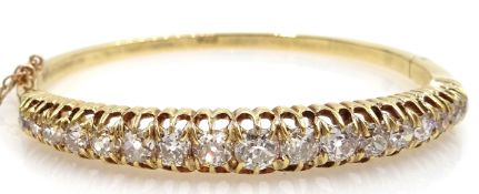 18ct gold seventeen stone graduating old cut diamond hinged bangle, diamonds approx 3.