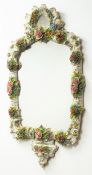 Sitzendorf porcelain floral encrusted wall mirror with scroll moulded frame and cresting, H83cm