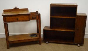 Art Deco oak bookcase, three staggered shelves flanked by single cupboard, on sledge feet (W91cm,