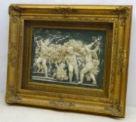 Pate-sur-pate style resin plaque, relief moulded with winged putti, within ornate glazed gilt frame,