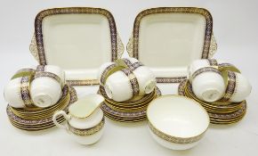 Wedgwood twelve setting tea service with cobalt blue and gilt floral border on plain ground (39)