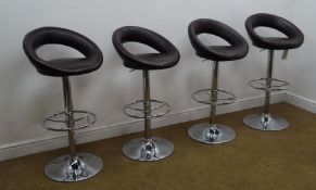 Set of four adjustable chrome finish bar stools, leatherette upholstered seat,