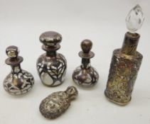 Three Edwardian Art Nouveau silver overlaid scent bottles, one dated 1907,