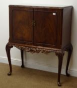 Reproduction mahogany cocktail cabinet, two doors enclosing fitted interior,