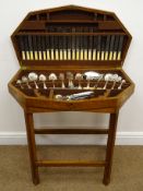 1930s canteen of silver-plated cutlery housed in oak table, with matched and other flatware,