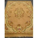 Indian beige ground rug, central floral medallion,