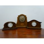 20th century inlaid oak cased mantel clock with silvered Arabic dial,