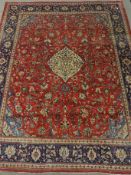 Persian Mahal red ground carpet, floral design, repeating blue ground border,