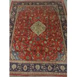 Persian Mahal red ground carpet, floral design, repeating blue ground border,