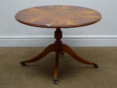 Quality yew wood circular pedestal table, cross banded and figured top on turned column,