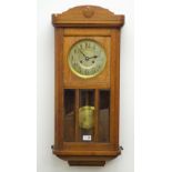 20th century oak cased wall clock with silvered Arabic dial and bevel glazed panel door,