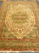 20th century Turkish carpet, green ground with geometric pattern,