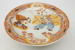 19th century Japanese porcelain warming plate, painted with Samurai Warriors in the Imari palette,