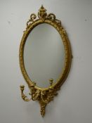 Ornate oval gilt frame Girandole mirror, three candle branches W55cm,