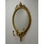 Ornate oval gilt frame Girandole mirror, three candle branches W55cm,